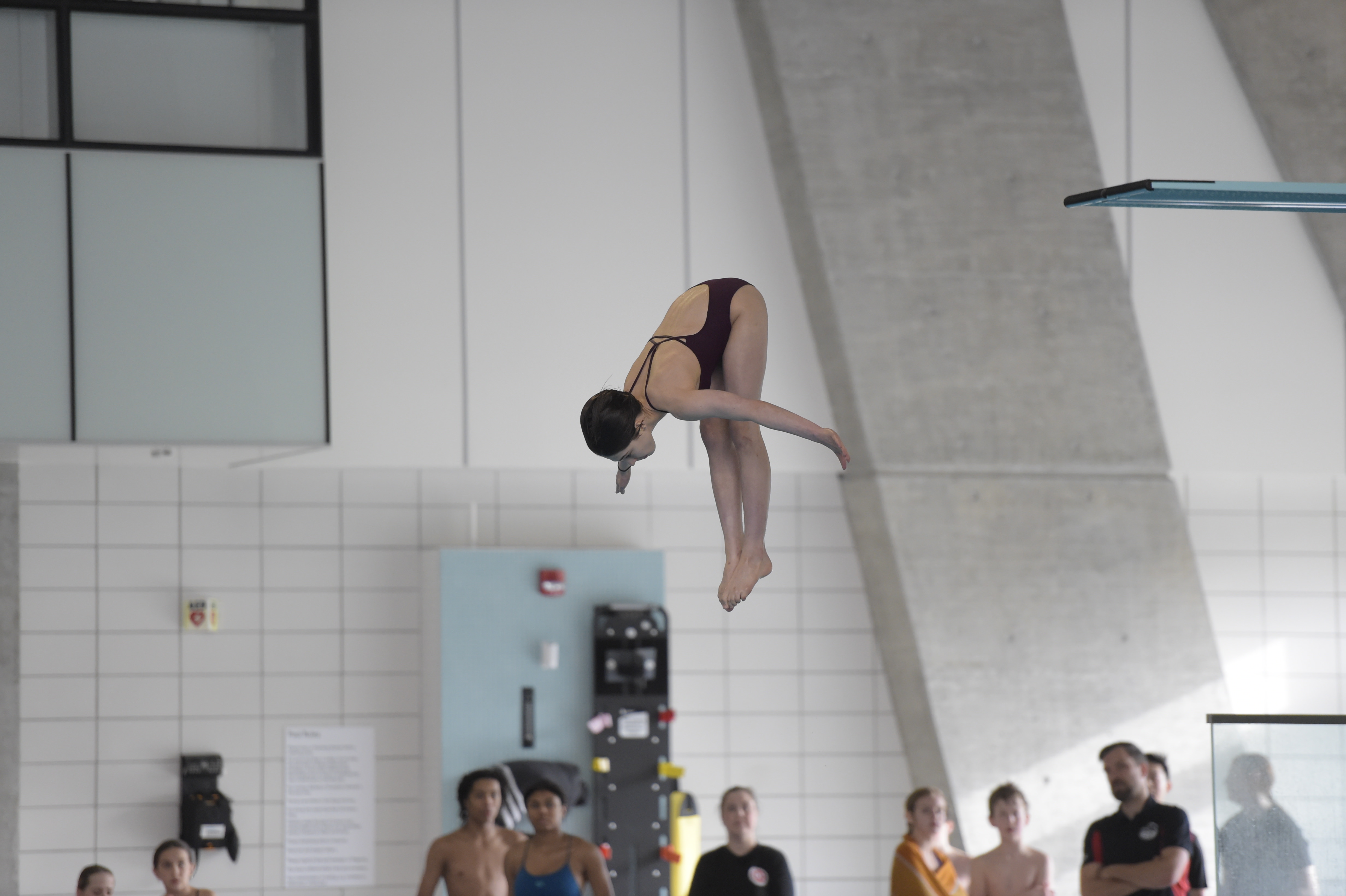 Level 4 diver performing advanced somersault dive